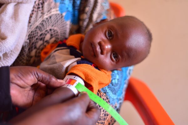 Albara's arm is measured as part of treatment for malnutrition. Photo: Save the Children